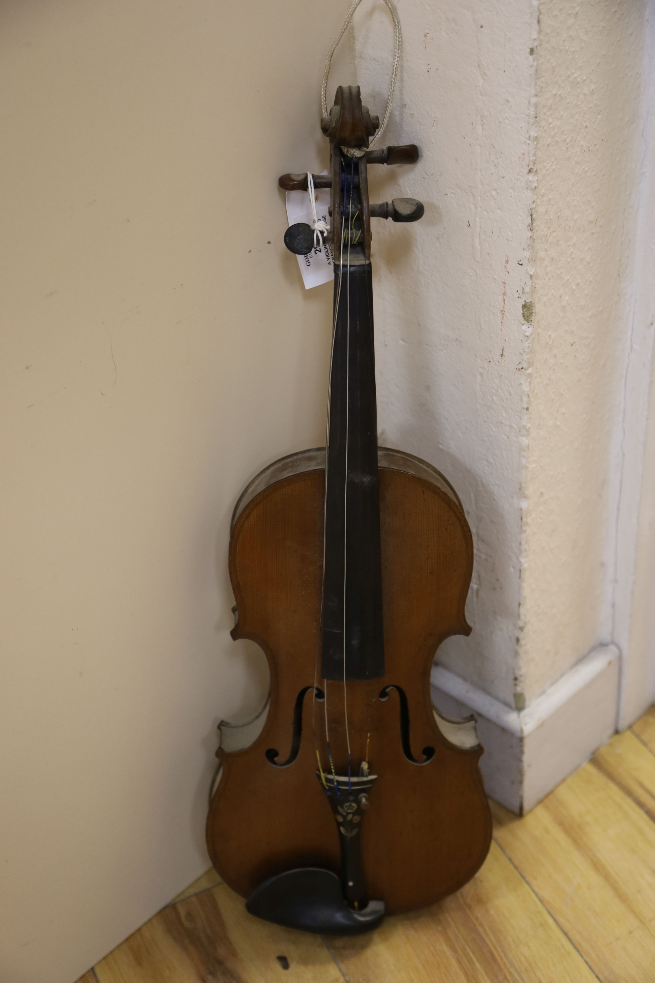 A violin labelled Francesco Ruggeri and a bow. Back of violin excluding button - 36cm